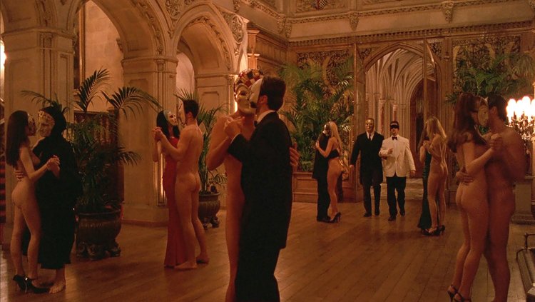 Mansion ballroom dance scene with Nick Nightingale (Todd Field) blindfolded, in  Eyes Wide Shut  (1999)